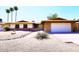 Charming single-story home with desert landscaping, brick accents, and an attached two-car garage at 1531 W Plana Ave, Mesa, AZ 85202