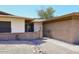 Single story home with brick accents, a gated entrance, and desert-style landscaping at 1531 W Plana Ave, Mesa, AZ 85202