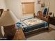 Cozy bedroom with a wooden bed frame, quilt, and decor at 305 S Val Vista Dr # 37, Mesa, AZ 85204
