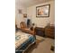 Bedroom features quaint decor, a quilt-covered bed, and warm lighting at 305 S Val Vista Dr # 37, Mesa, AZ 85204