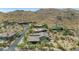 Expansive aerial view of desert homes with tile roofs nestled in a scenic, mountainous desert community at 8006 S 38Th Pl, Phoenix, AZ 85042