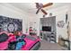 Well lit bedroom featuring neon lights, plush bedding, and various decor at 8006 S 38Th Pl, Phoenix, AZ 85042