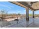 Elegant covered patio featuring a cozy fire pit and scenic views of the backyard pool at 8006 S 38Th Pl, Phoenix, AZ 85042