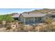 Exterior view of a large home featuring stucco siding and a fenced yard at 8006 S 38Th Pl, Phoenix, AZ 85042