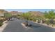 Scenic neighborhood entrance with gated access, desert landscaping, and mountain backdrop at 8006 S 38Th Pl, Phoenix, AZ 85042