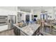 Open kitchen layout with an island, stainless steel appliances, and dining space at 8006 S 38Th Pl, Phoenix, AZ 85042