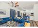 Bright and spacious living room with hardwood floors, modern decor, and a cozy fireplace at 8006 S 38Th Pl, Phoenix, AZ 85042