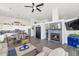 Open-concept living space with a cozy fireplace, dining area, and modern kitchen at 8006 S 38Th Pl, Phoenix, AZ 85042