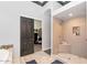 Elegant bathroom with a spacious shower, soaking tub, and walk-in closet access at 8006 S 38Th Pl, Phoenix, AZ 85042