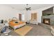 Serene bedroom with a fireplace, cozy decor, and warm lighting at 8006 S 38Th Pl, Phoenix, AZ 85042