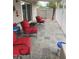 Relaxing patio with red chairs and a stone tile floor at 501 W Jasper Dr, Chandler, AZ 85225