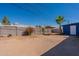 Spacious backyard, featuring a blue shed and a palm tree at 3115 N 55Th Ave, Phoenix, AZ 85031