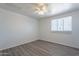 Simple bedroom with grey flooring and white brick accent wall at 3115 N 55Th Ave, Phoenix, AZ 85031