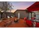 Charming backyard with lounge chairs, fire pit, dining area, and a well-maintained patio at 322 N 11Th Pl, Phoenix, AZ 85006