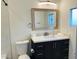 Modern bathroom with a vanity and a framed mirror at 322 N 11Th Pl, Phoenix, AZ 85006