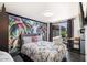 Beautifully decorated bedroom with a tropical mural, stylish furnishings, and private patio access at 322 N 11Th Pl, Phoenix, AZ 85006