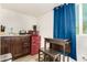 Charming kitchenette with a sink, cooktop, microwave, mini refrigerator, and breakfast bar at 322 N 11Th Pl, Phoenix, AZ 85006