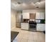 Clean kitchen with stainless steel appliances and white cabinets at 6830 N 10Th Pl, Phoenix, AZ 85014