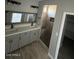 Bathroom with a double sink vanity and a tiled shower at 504 N 297Th Ln, Buckeye, AZ 85396