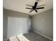 Bedroom features a ceiling fan and a closet at 504 N 297Th Ln, Buckeye, AZ 85396