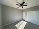 Bedroom features a ceiling fan and a closet at 504 N 297Th Ln, Buckeye, AZ 85396