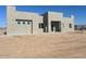 Stunning single-story home with modern architecture and neutral-colored stucco finish at 504 N 297Th Ln, Buckeye, AZ 85396