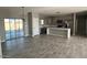 Open kitchen concept with stainless appliances, island and seamless access to living spaces at 504 N 297Th Ln, Buckeye, AZ 85396