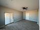 Spacious living room with lots of light and a ceiling fan at 504 N 297Th Ln, Buckeye, AZ 85396