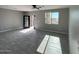 Spacious living room with tile floors, modern doors, and great natural lighting at 504 N 297Th Ln, Buckeye, AZ 85396