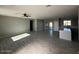 Bright living room with tile flooring, recessed lighting, and access to the kitchen at 504 N 297Th Ln, Buckeye, AZ 85396
