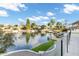 Scenic lake view with lush landscaping and waterfront homes on a sunny day at 5439 S Lighthouse Ln, Tempe, AZ 85283