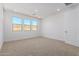 Bright bedroom with neutral carpet and three windows at 7386 W Bent Tree Dr, Peoria, AZ 85383