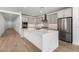 Modern kitchen with gray cabinets, stainless steel appliances, and a large island at 7386 W Bent Tree Dr, Peoria, AZ 85383