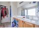 Clean bathroom with single sink vanity, shower, and mirror at 14727 N Gil Balcome N Ct, Surprise, AZ 85379