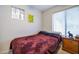 Bedroom with double bed, window blinds, and wood nightstand at 14727 N Gil Balcome N Ct, Surprise, AZ 85379