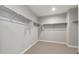 A large walk-in closet with carpet flooring and metal shelving at 2851 N Coronado Dr, Florence, AZ 85132