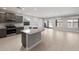 Spacious, open kitchen featuring gray cabinets, stainless appliances and a granite breakfast bar at 2851 N Coronado Dr, Florence, AZ 85132