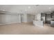 Open concept kitchen with gray cabinets, stainless appliances, granite countertops, and tile flooring at 2851 N Coronado Dr, Florence, AZ 85132