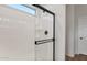 Shower with black hardware and glass door in a modern bathroom at 2868 N Coronado Dr, Florence, AZ 85132