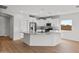 A well lit kitchen with stainless steel appliances, granite countertops, and white cabinetry at 2868 N Coronado Dr, Florence, AZ 85132