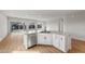 Stylish kitchen island with stainless steel dishwasher and granite countertops at 2868 N Coronado Dr, Florence, AZ 85132