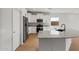 Modern kitchen with stainless steel appliances, white cabinets, and granite countertops at 2868 N Coronado Dr, Florence, AZ 85132