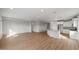 Spacious living room with natural light, wood-look tile floors, and open layout at 2868 N Coronado Dr, Florence, AZ 85132