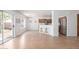 Open dining space with access to the backyard and a view of the kitchen with stainless steel appliances at 31777 N Sundown Dr, San Tan Valley, AZ 85143