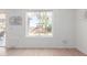 Bright living room with a view of the backyard, featuring a playset and mature trees at 31777 N Sundown Dr, San Tan Valley, AZ 85143