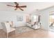 Bright living room with natural light, a modern sofa set, and views of the backyard at 31777 N Sundown Dr, San Tan Valley, AZ 85143