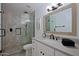 Updated bathroom with a walk-in shower, stylish tile, and modern vanity at 5998 N 78Th St # 208, Scottsdale, AZ 85250