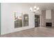 Bright dining room features wood-look floors, fireplace, and sliding glass doors at 4062 E Round Hill Dr, Phoenix, AZ 85028