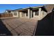 New construction backyard with covered patio and desert landscaping, perfect for outdoor living at 32535 N 135Th Dr, Peoria, AZ 85383