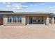 Rear exterior view showcasing the outdoor living space and architectural design of this home at 32535 N 135Th Dr, Peoria, AZ 85383